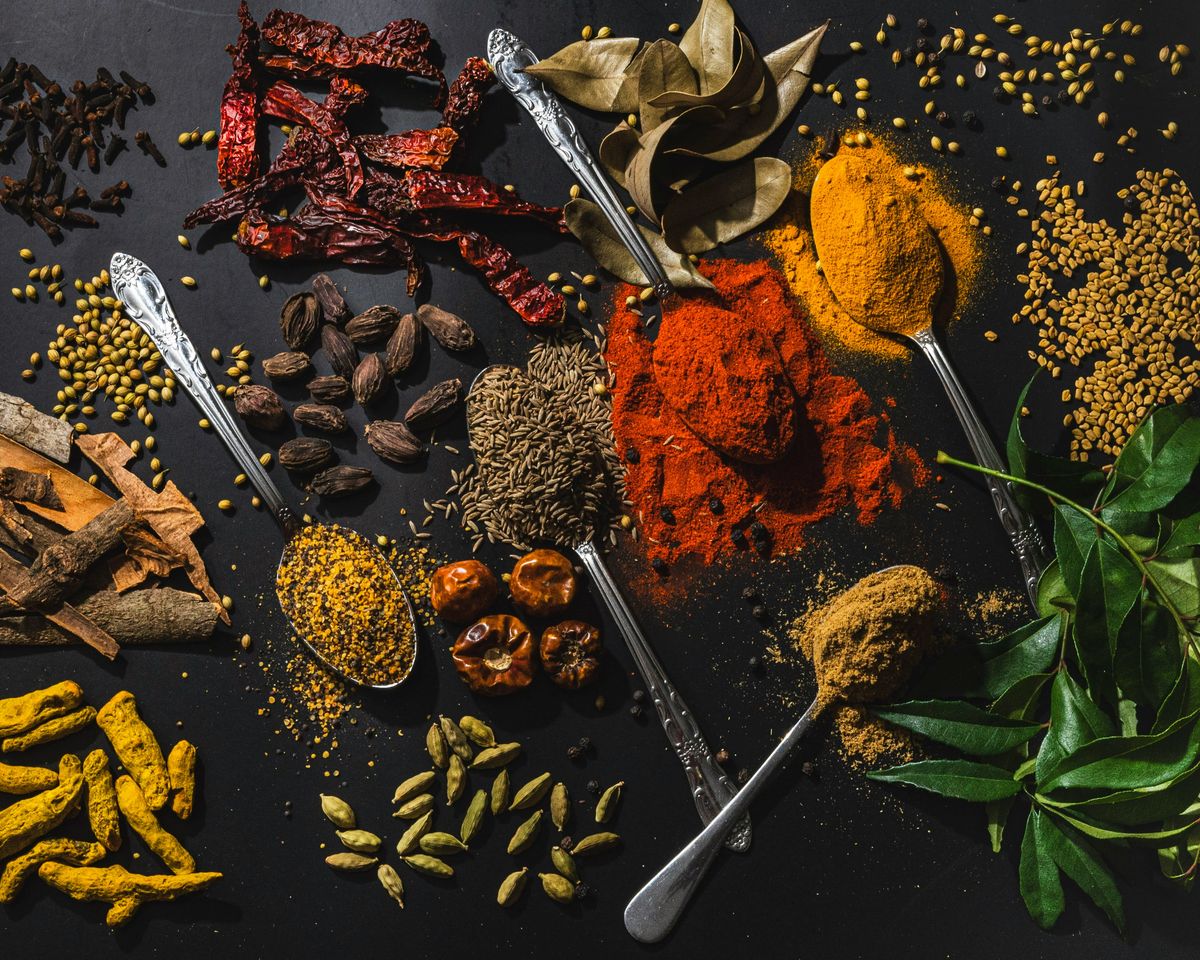 Indian spices including turmeric, chilli, cumin and cardamom arranged for export